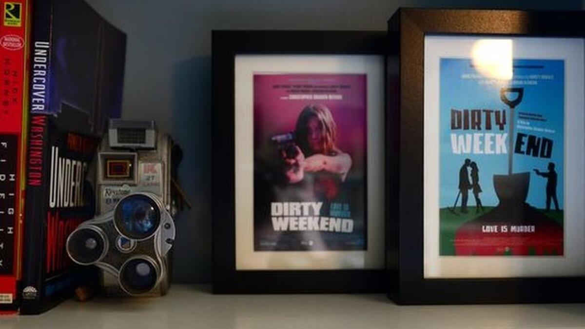 
Postcards from a movie written by local film maker Geoffrey Gunn sit on a shelf in his home office.
