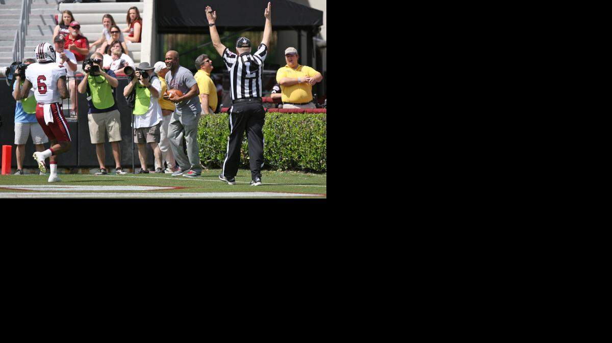 
Darius Rucker hauls in a 22-yard touchdown catch from South Carolina quarterback Connor Mitch in the annual Garnet and Black Spring Game at Williams-Brice Stadium.
