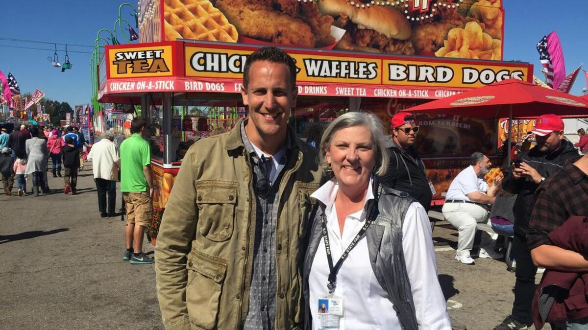 ‘Carnival Eats’ host Noah Cappe with SC State Fair’s assistant general manager Nancy Smith.