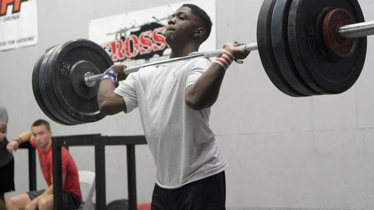 CJ Cummings practices the push jerk while training at Crosssfit Beaufort on Sept. 11, 2015 in Beaufort.