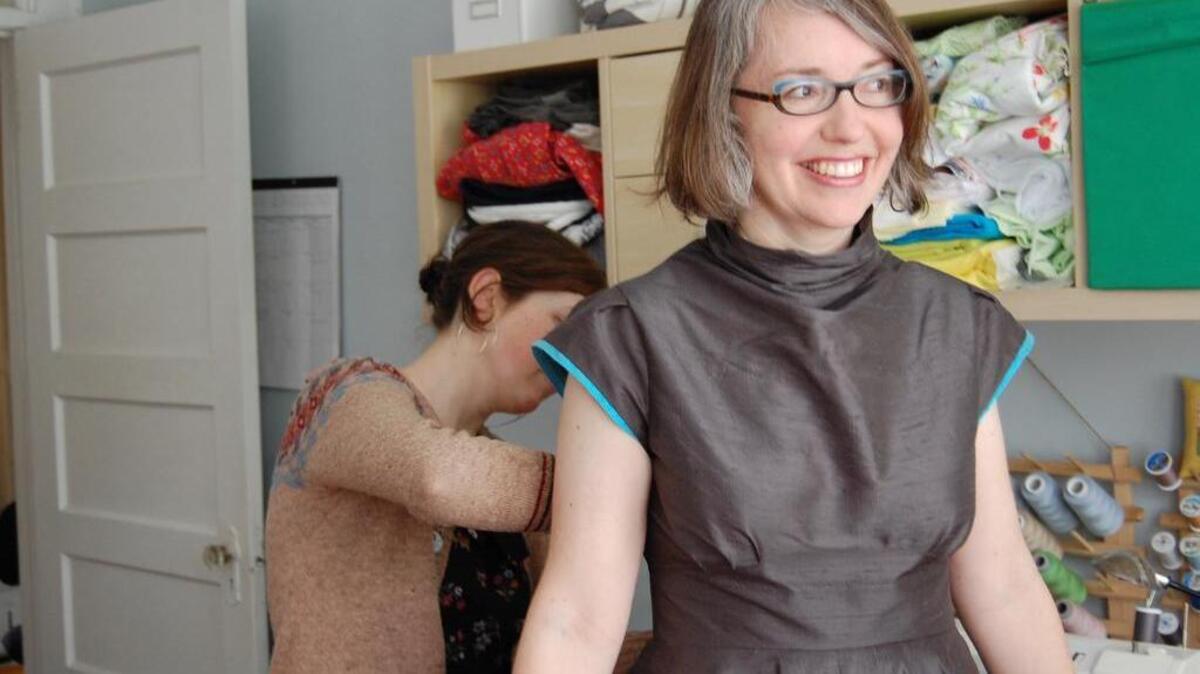 Jessica Bornick adjusts Molly Ledford’s Grammy dress. Ledford was nominated for Best Children’s Album.