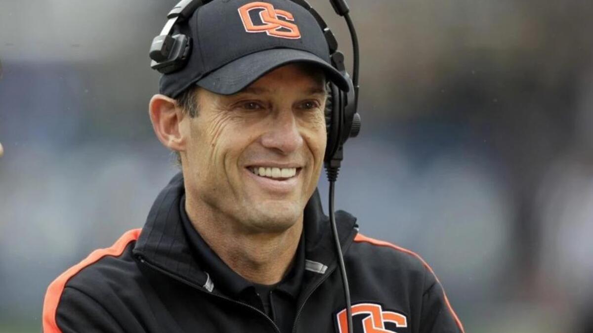 Then-Oregon State head coach Mike Riley smiles before the start of an NCAA college football game against Brigham Young University in Provo, Utah. Nebraska hired Riley as its new football coach in December 2014