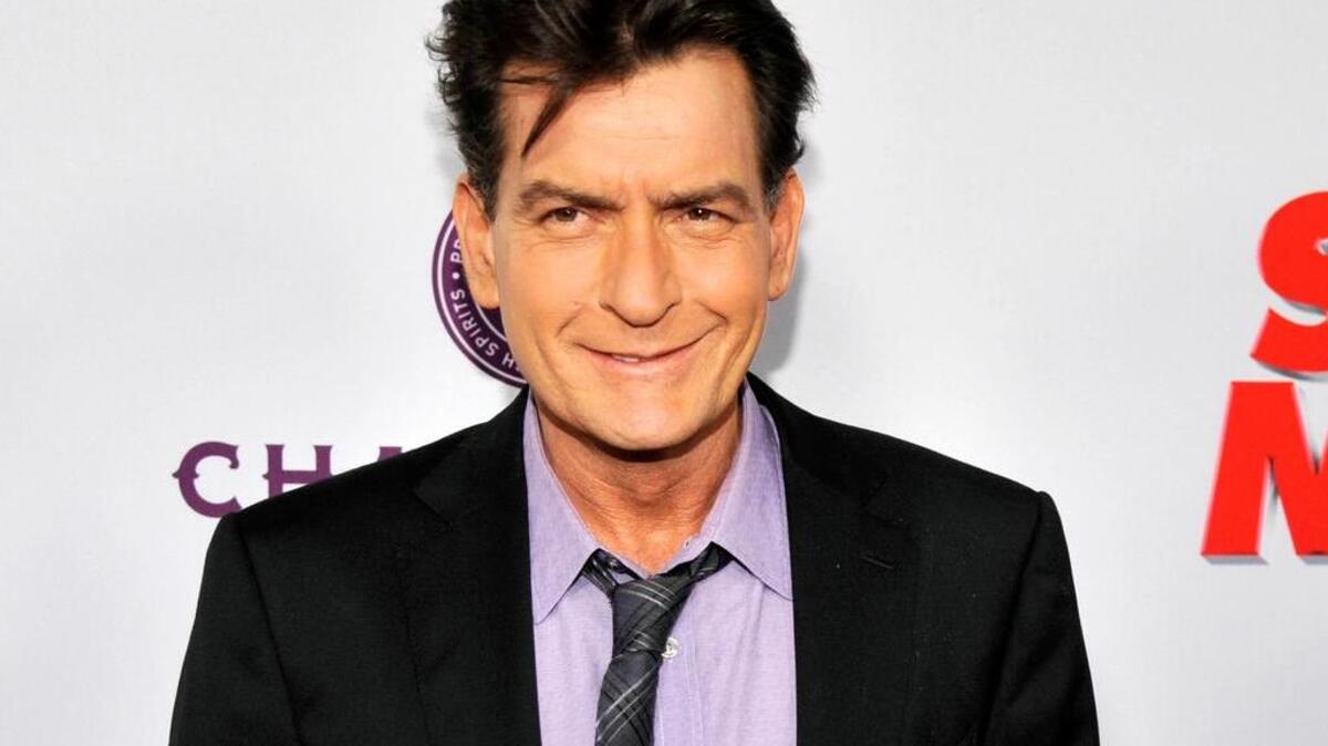 FILE - In this April 11, 2013 file photo, Charlie Sheen, a cast member in "Scary Movie V," poses at the Los Angeles premiere of the film at the Cinerama Dome in Los Angeles. Sheen is set to “make a revealing personal announcement” on NBC’s “Today” show on Tuesday, Nov. 17, 2015, NBC announced on Monday. (Photo by Chris Pizzello/Invision/AP, file)