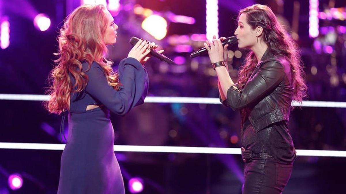 Teresa Guidry, left, sings with Angie Keilhauer during Tuesday’s battle round on NBC’s “The Voice.” Guidry, 22, who is from Rock Hill and now lives in Nashville, was eliminated Monday.