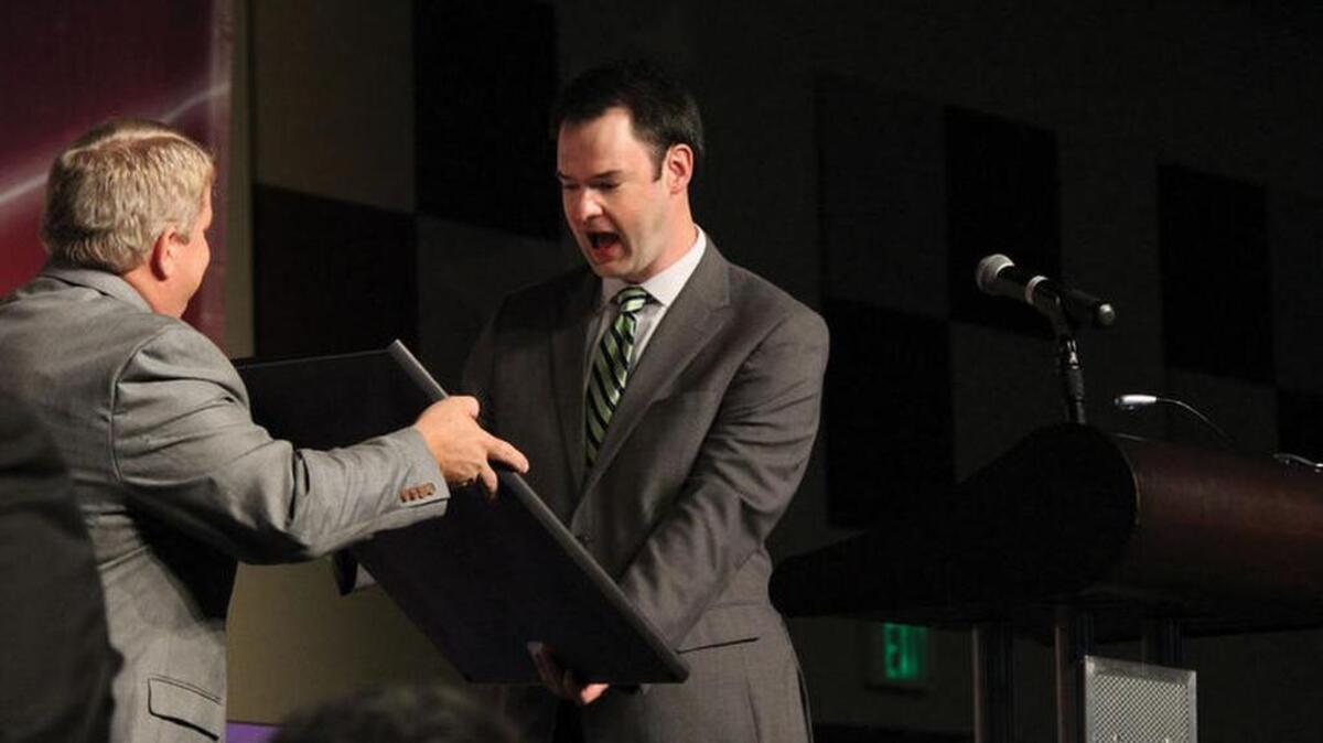 
Ben Ingram, right, was surprised with a map of Florence from the early 1900's Tuesday Oct. 13 at The 14th Annual School Foundation Gala at SiMT. Ingram was the winner of the 2014 Jeopardy! Tournament of Champions and the TSF 2015 Distinguished Graduate.
