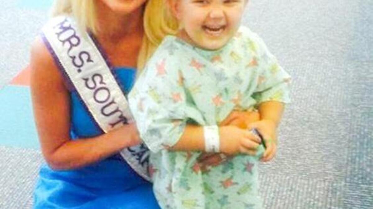 Mrs. South Carolina International Dana Boutwell will compete for the Mrs. International crown this week, representing Cookies for Kids’ Cancer as her platform. Boutwell has visited all five children’s hospitals across the state during her reign, interacting with the children and advocating for pediatric cancer research. Boutwell is pictured with AJ, 3, a patient at McLeod Children’s Hospital in Florence.
