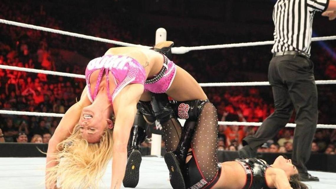 Ashley Fliehr, or Charlotte, now has her own action figure, appears on the upcoming cover of “Muscle & Fitness” magazine, and young fans post photos of themselves trying the “bridge” from her Figure 8 (her version of her dad’s famous finisher the Figure Four) on opppnent, Paige.