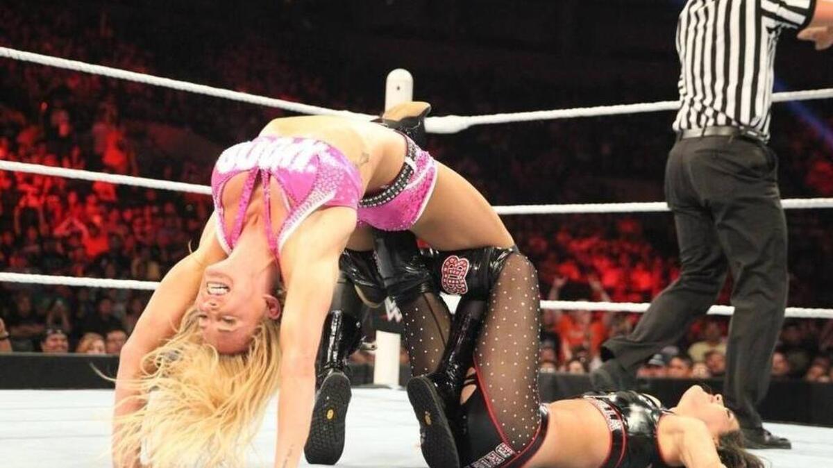 Ashley Fliehr, or Charlotte, now has her own action figure, appears on the upcoming cover of “Muscle & Fitness” magazine, and young fans post photos of themselves trying the “bridge” from her Figure 8 (her version of her dad’s famous finisher the Figure Four) on opppnent, Paige.