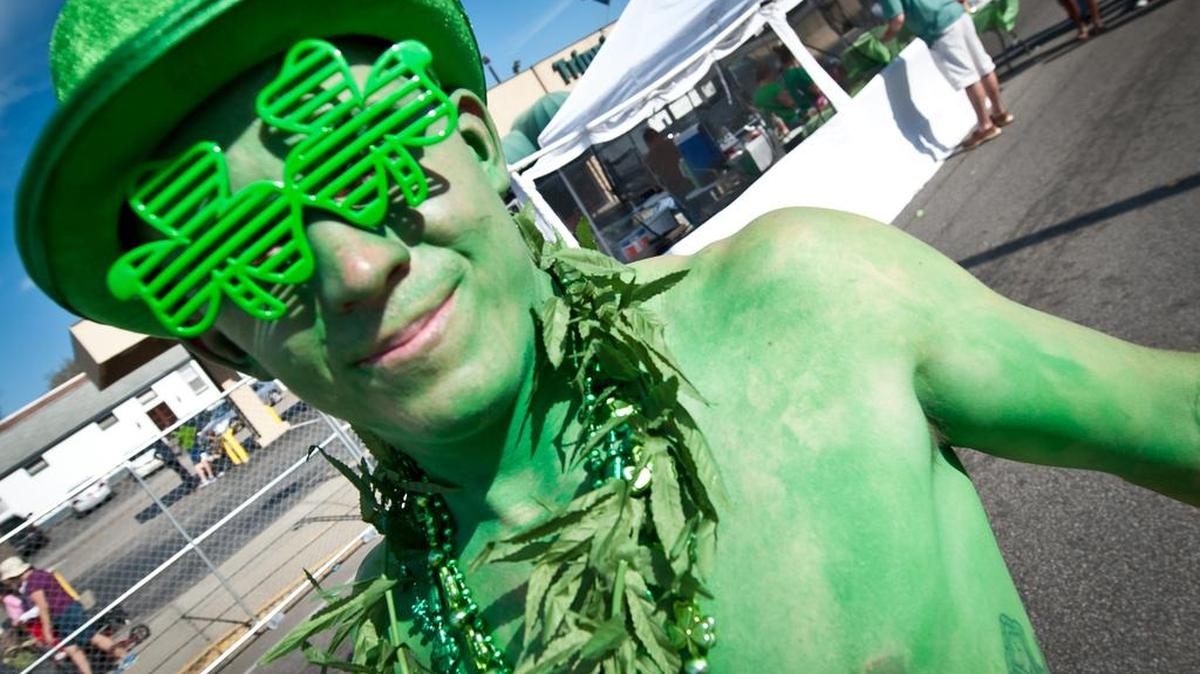 A festivalgoer walks along Harden Street during a past St. Pat’s in Five Points.