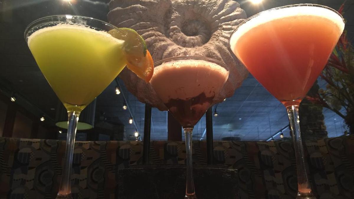 A selection of martini-style cocktails from Blue Fin Seafood Restaurant and Bar, including The Mermaid, left, and a chocolate martini, center.