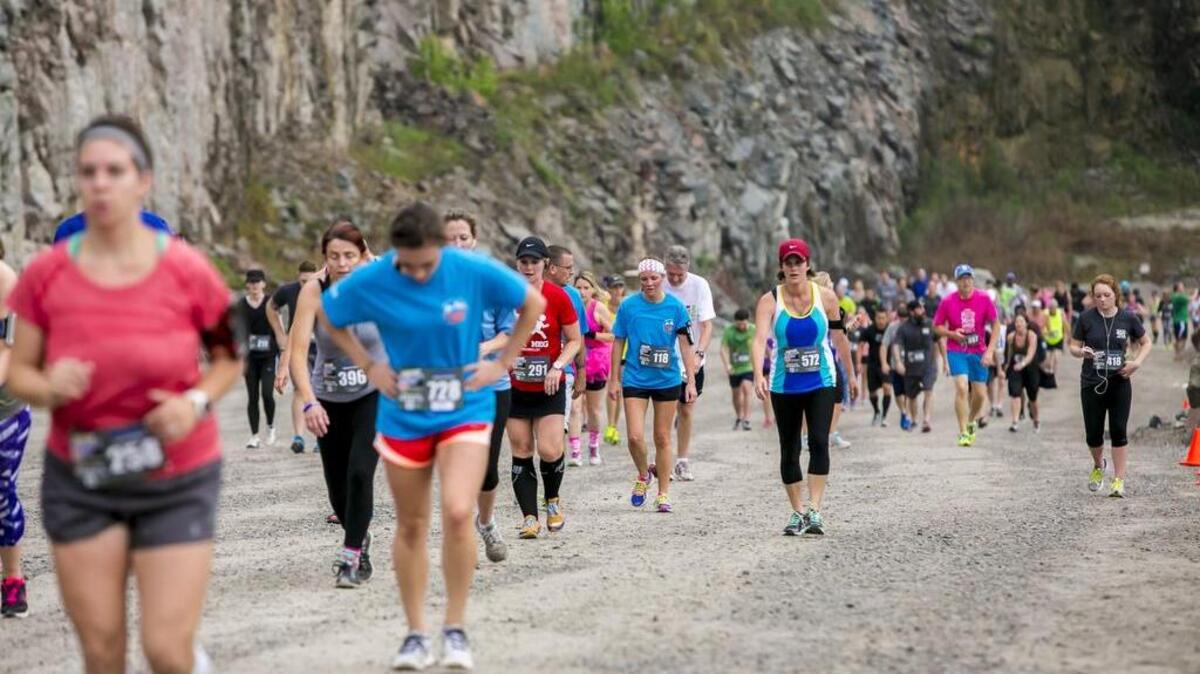 Runners climb the steep grade during the Quarry Crusher Run at the Vulcan Quarry near the Olympia neighborhood.