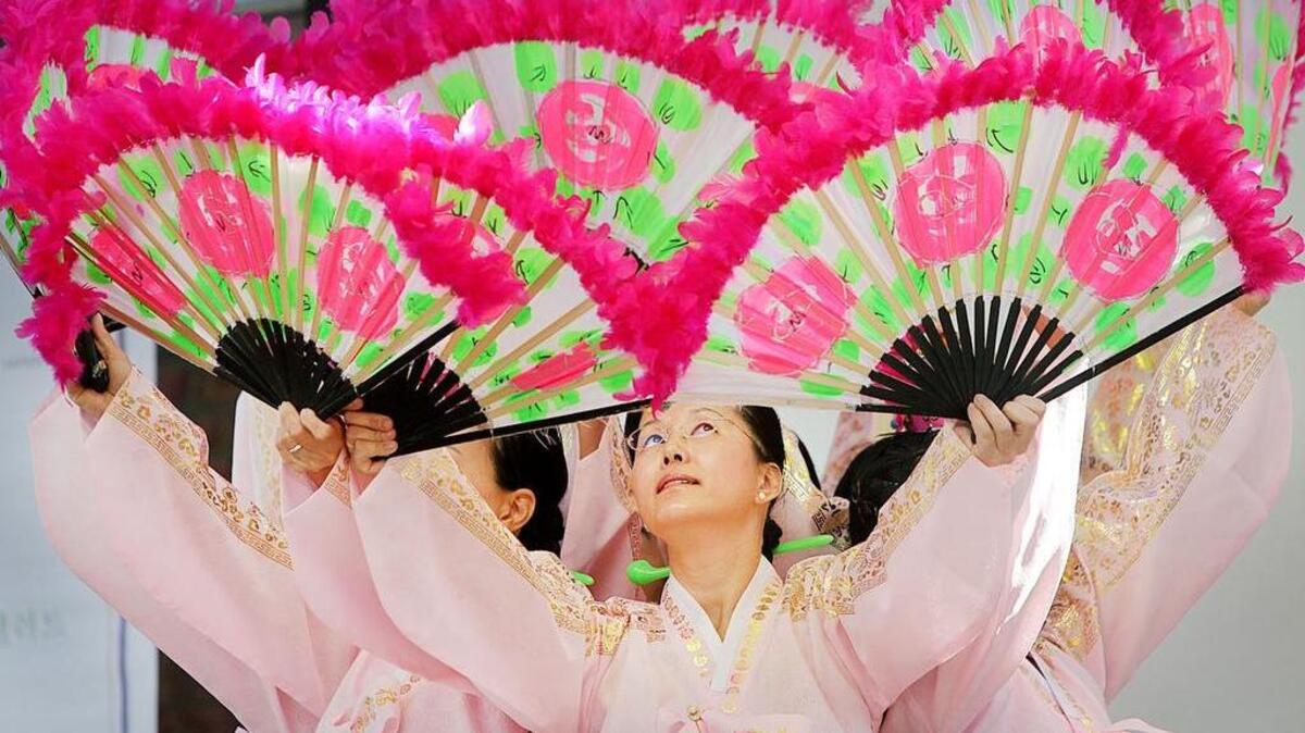 Soonja Jeon and the Fan Dancers perform during the annual Korean festival. The Eighth Annual Korean Fall Festival was held Saturday at the Korean Community Presbyterian Church. The festival celebrates Korean culture and heritage through dance, traditional clothing and food.