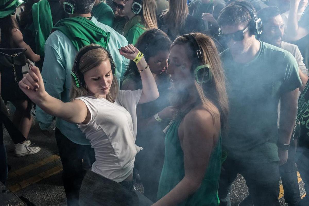 St. Pat’s in Five Points festivalgoers dance in the Silent Disco tent.