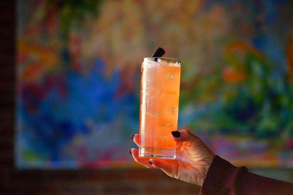 A tall glass of spirits at Hendrix’s, Main Street’s newest rooftop bar.