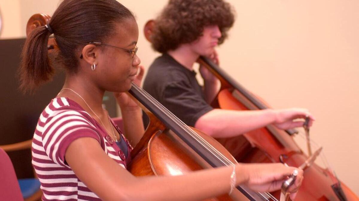 Students learn how to play string instruments in USC Strings Project classes.