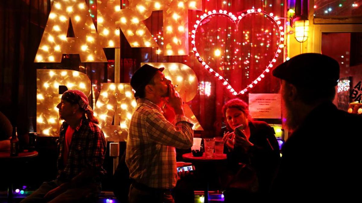 A crowd gathers outside the Art Bar in the Vista on a Wednesday evening.