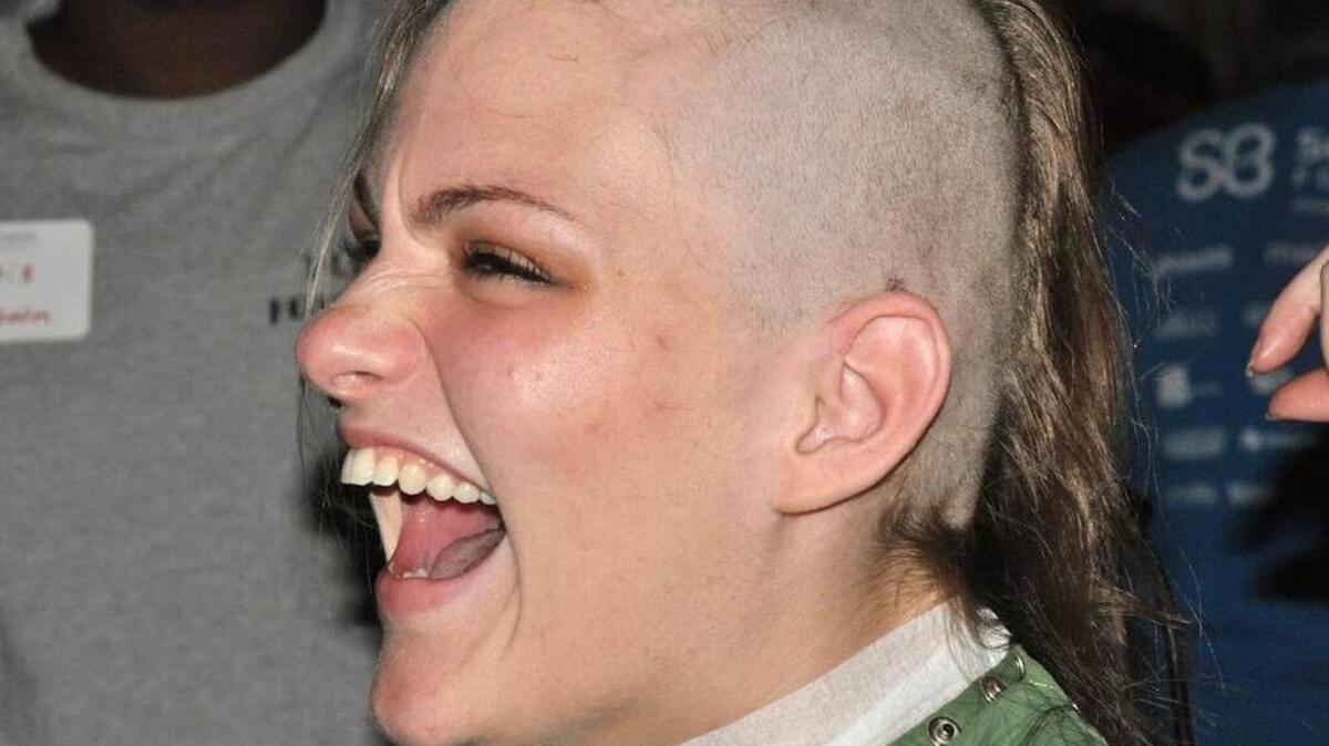 A participant gets a shave during a previous fundraiser.