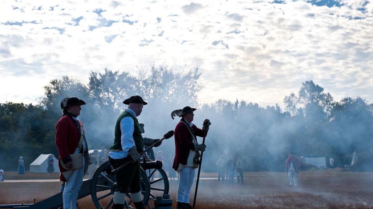 Men from the Royal North Carolina Regiment practice firing a cannon at the 43rd annual Field Days at the Camden Revolutionary War Park.