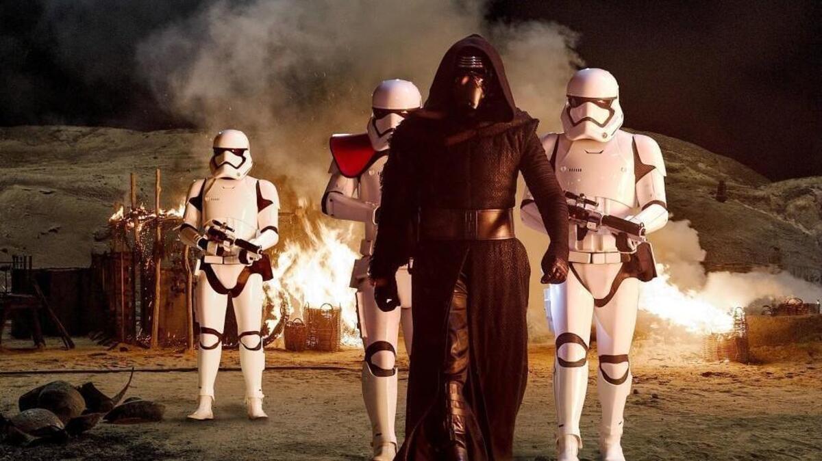 From “Star Wars: The Force Awakens,” Kylo Ren (Adam Driver) with Stormtroopers