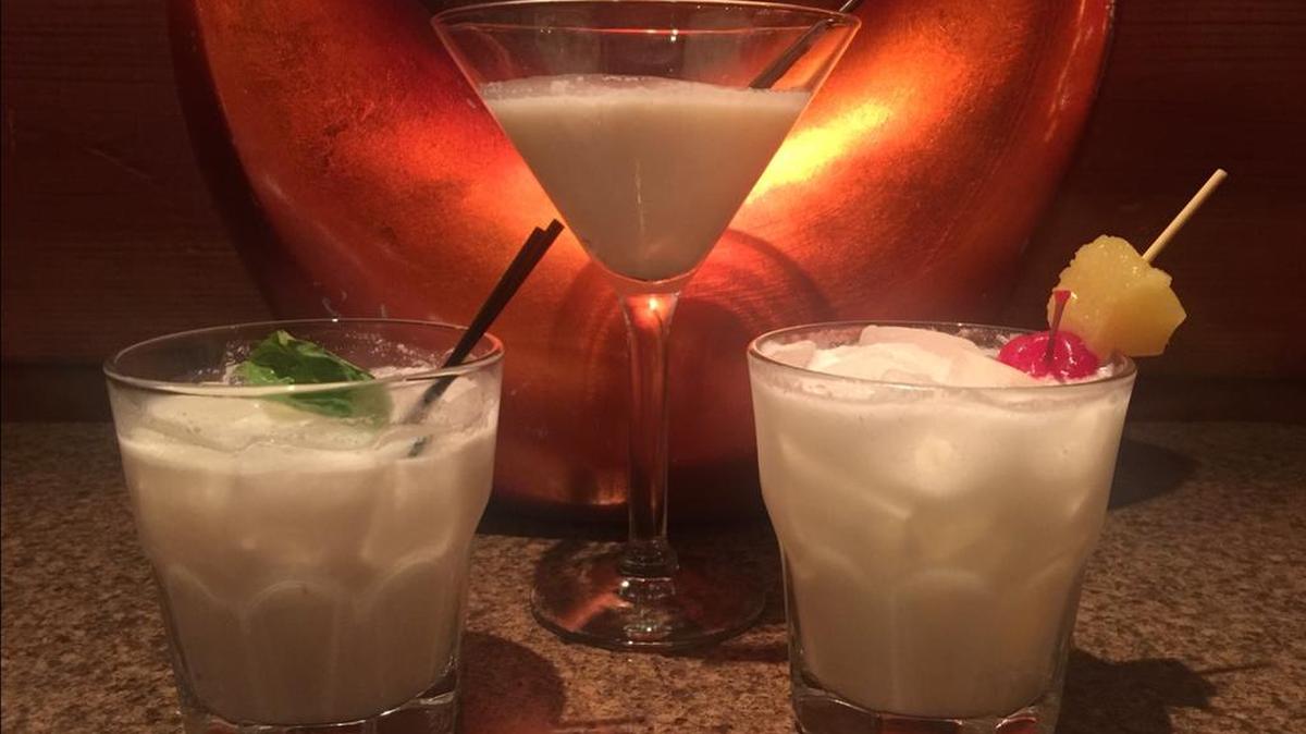 Bistro on the Boulevard’s cream-based cocktails include, from left, the “sin-cicle,” Bistro’s “magic martini” and a pineapple upside-down.