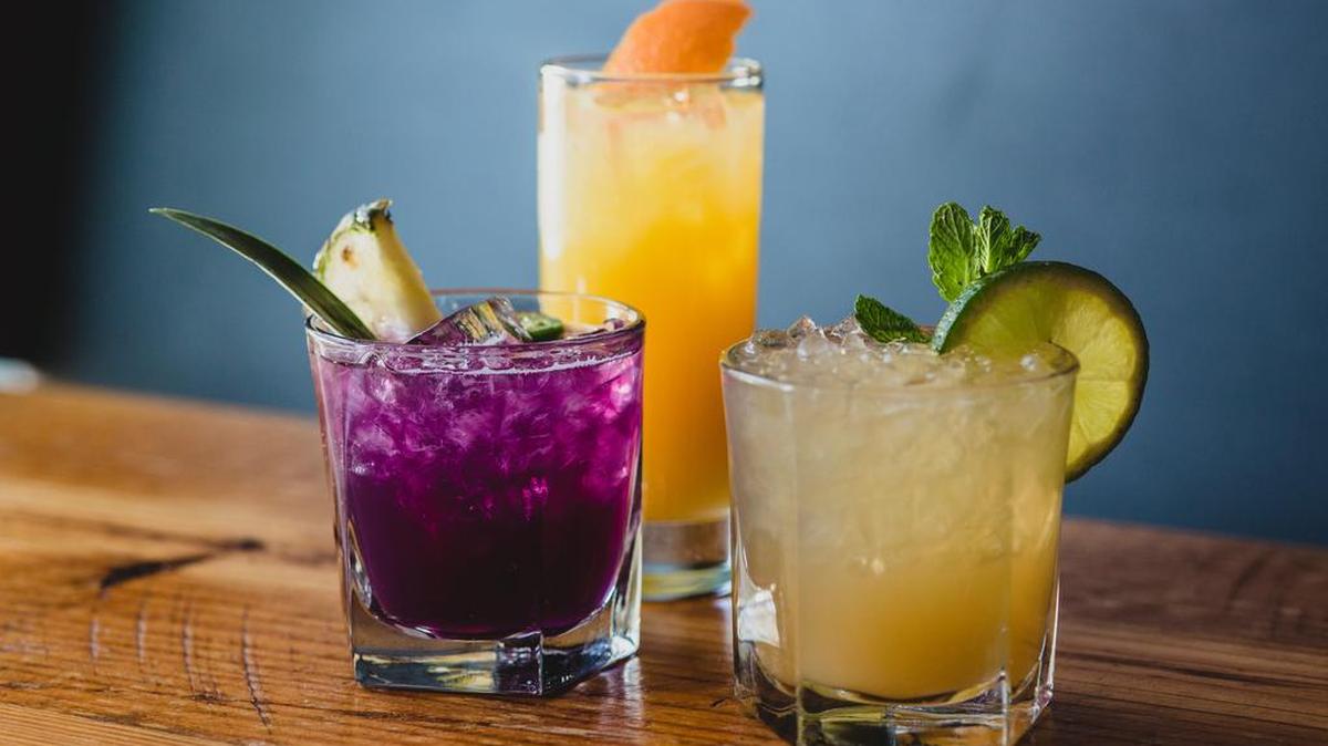 Tiki Week cocktails at Bourbon include, from left, Paloma’s Revenge, the Scorpion and a mai tai.