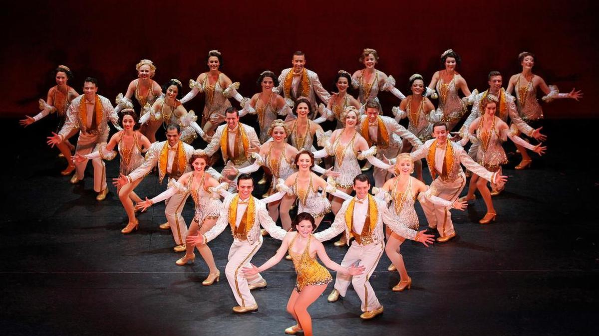 Caitlin Ehlinger as Peggy Sawyer, center, and the Company of 42nd Street