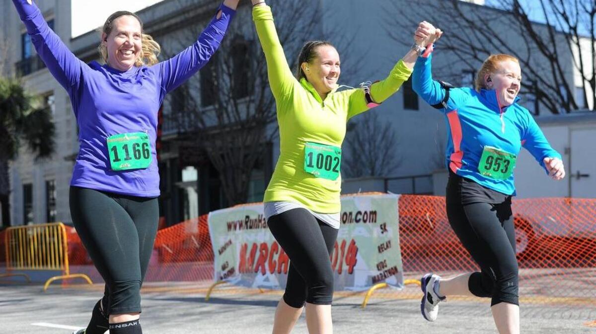 Pam Hutchinson, from left, Allison Cogdill and Katie Bowman, all of Lexington, approach the finish line on Main Street during a past Run Hard Columbia Marathon.