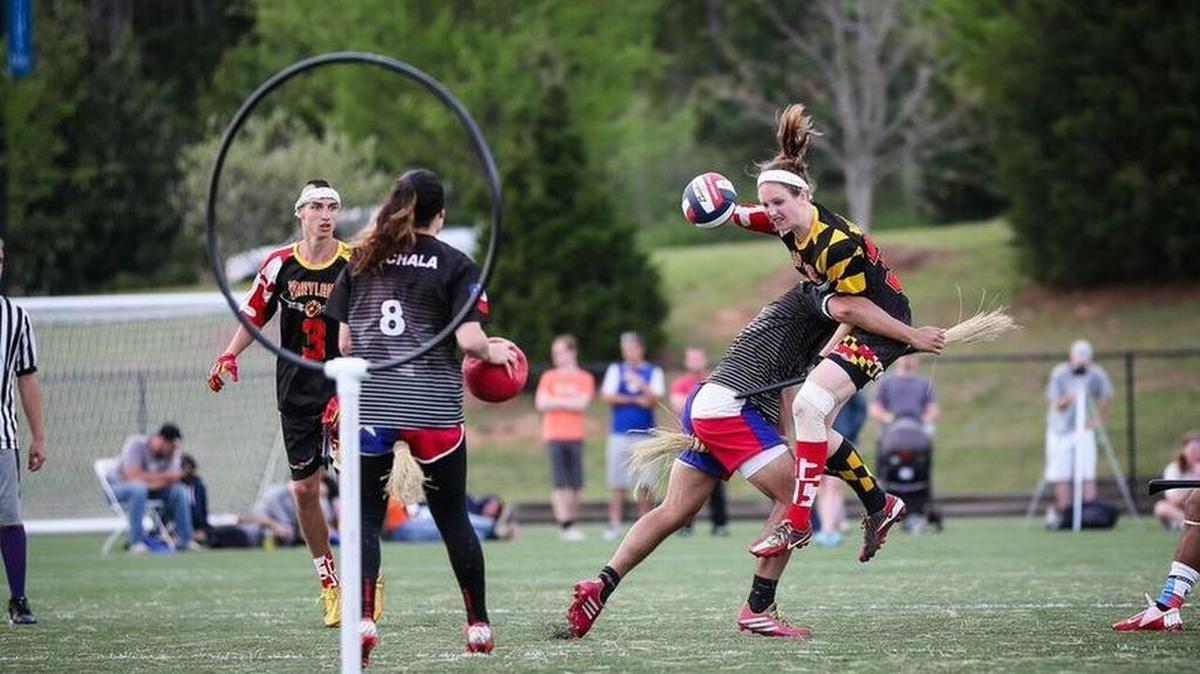 Quidditch players from Lone Star College in The Woodlands, Texas, block University of Maryland opponents from making goals.