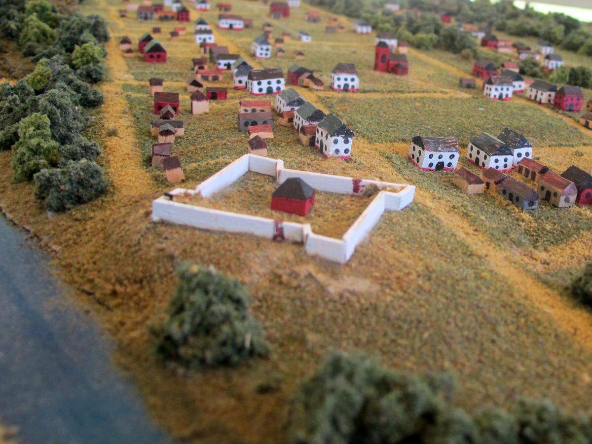 A model depicts what the 17th-century settlement that is now the Colonial Dorchester State Historic Site may have looked like.