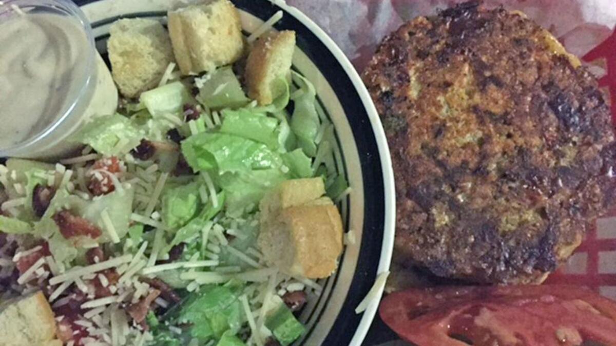 Shrimp burger with Caesar salad at Cock ’N Bull