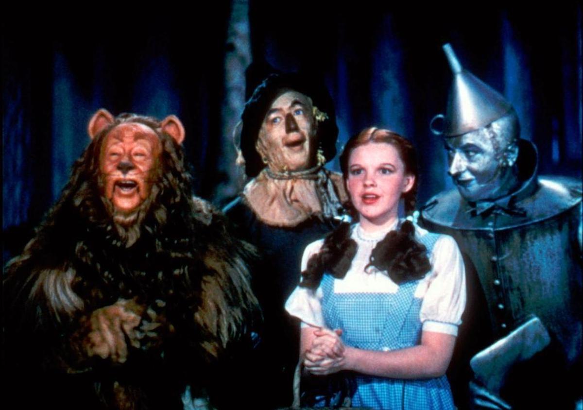 In this 1939 file photo originally released by Warner Bros., from left, Bert Lahr as the Cowardly Lion, Ray Bolger as the Scarecrow, Judy Garland as Dorothy, and Jack Haley as the Tin Woodman, are shown in a scene from “The Wizard of Oz.”