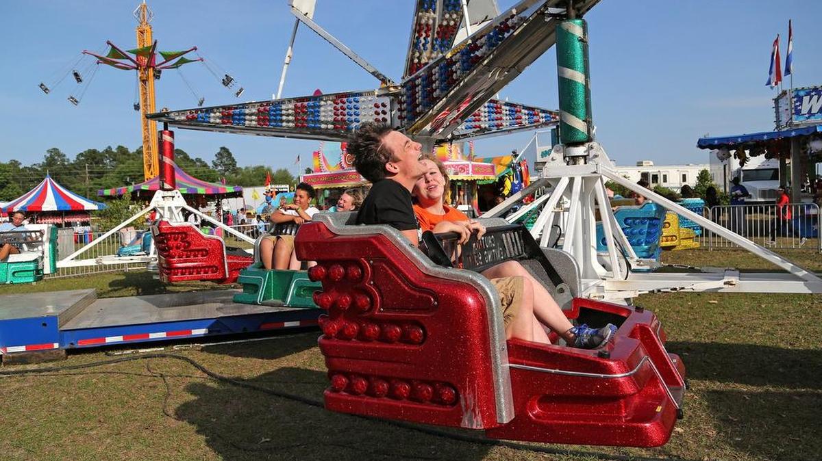 Taking a spin on one of the rides at Sparkleberry Country Fair.