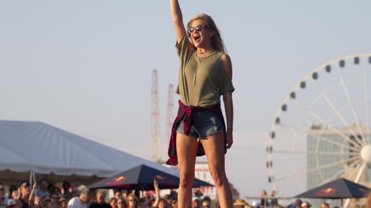 Kelsea Ballerini entertains her fans from center stage on the ocean front in Myrtle Beach. Crowds swelled on the third day of the Carolina Country Music Fest to hear some of their favorite artists at the old Pavilion site in Myrtle Beach. Saturday, June 11, 2016.
