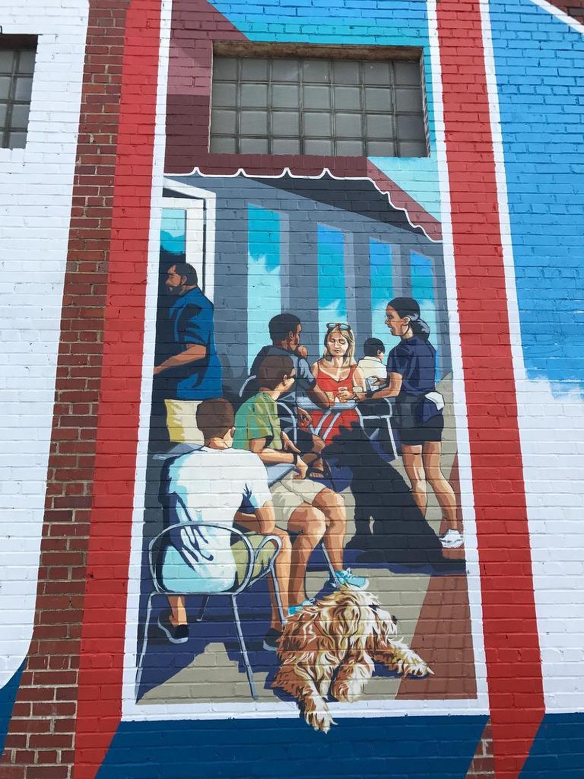 Artist Chad Brady wants his mural to communicate “why you should want to go to Five Points,” he said. “It’s music and the St. Patrick’s Day festival and people eating at a cafe, people shopping, getting haircuts – just a social hub that you come down to.”