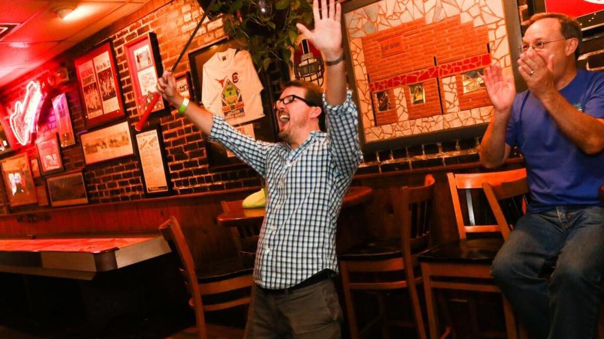 Andrew Dalzell celebrates a hole-in-one at Bar None during a past Long's Bar Stool Classic.