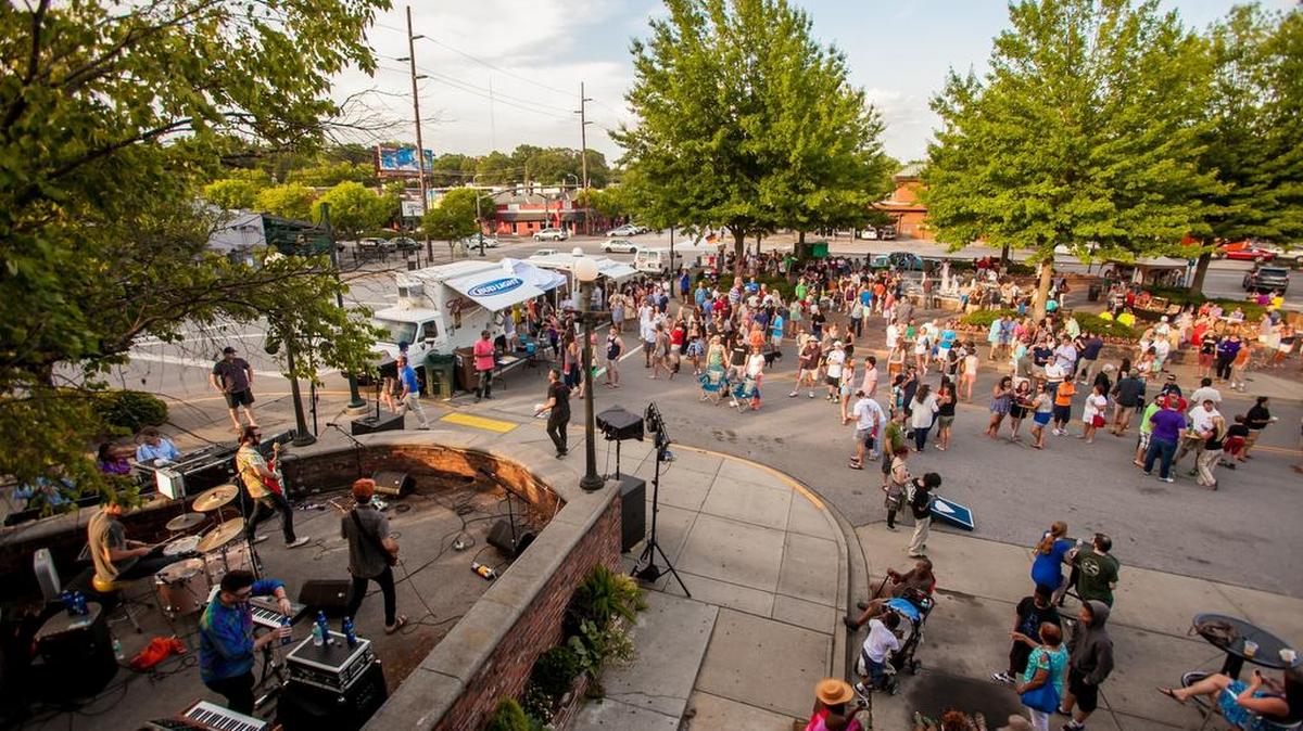 Attendees listen to the Tarlatans perform during a Five After Five concert in Five Points last year.