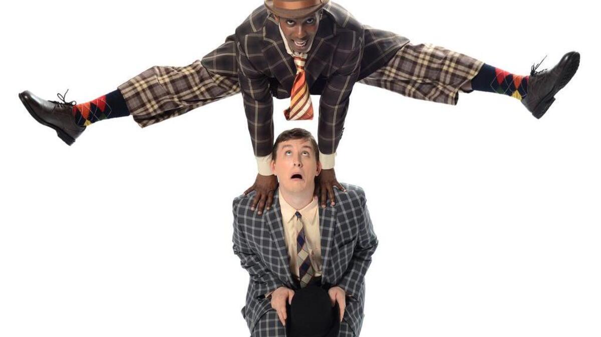 University of South Carolina acting students Dimitri Woods (leaping) and Matt Cavender.