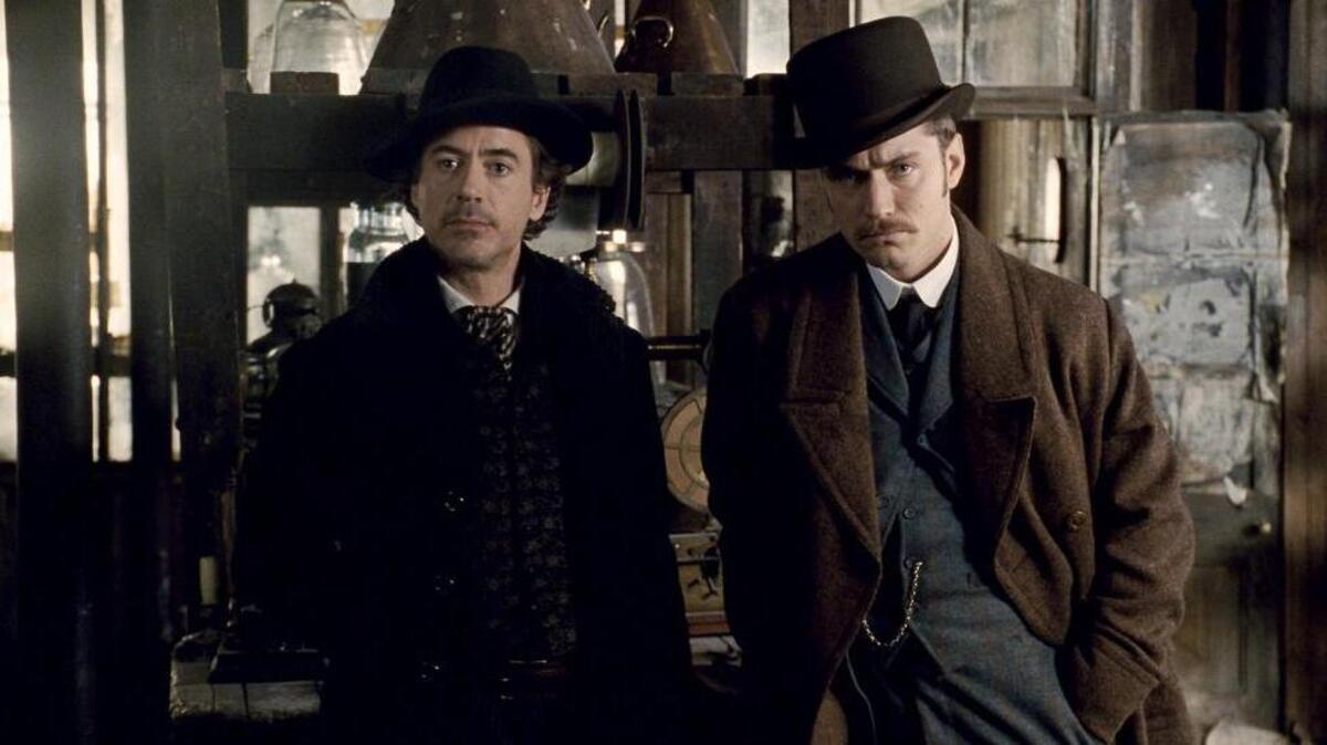 See Robert Downey Jr., left, as Sherlock Holmes and Jude Law as Dr. John Watson in “Sherlock Holmes” Thursday at Boyd Plaza at Columbia Museum of Art.