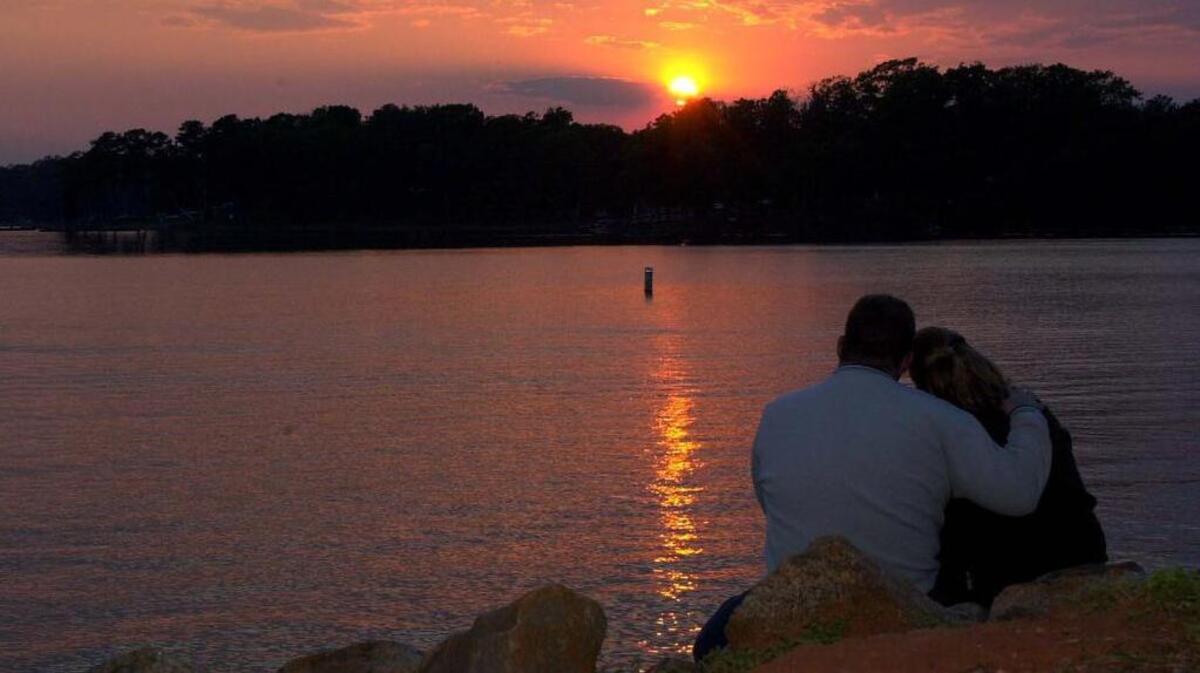 Couple enjoying the lake at night.