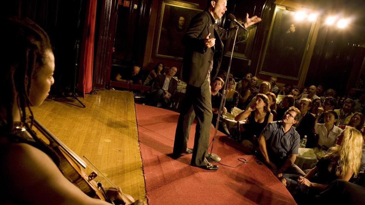 George Dawes Green – who founded The Moth, the New York literary society that pioneered story slams – speaks at a storytelling event.