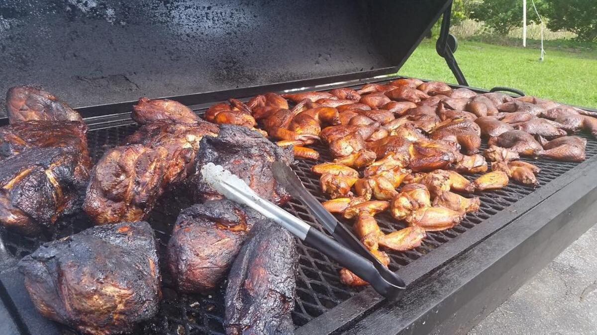 
Meat cooks on the smoker at Roy’s Grill.
