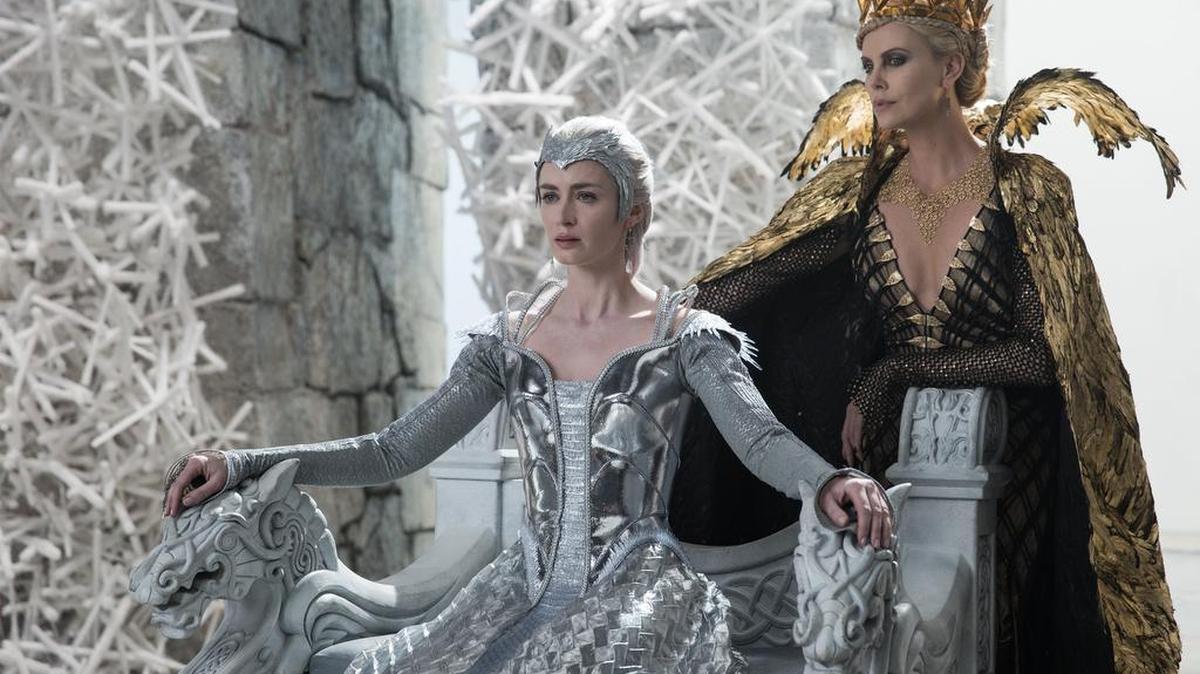 Emily Blunt, left, and Charlize Theron in “Huntsman: Winter’s War.”