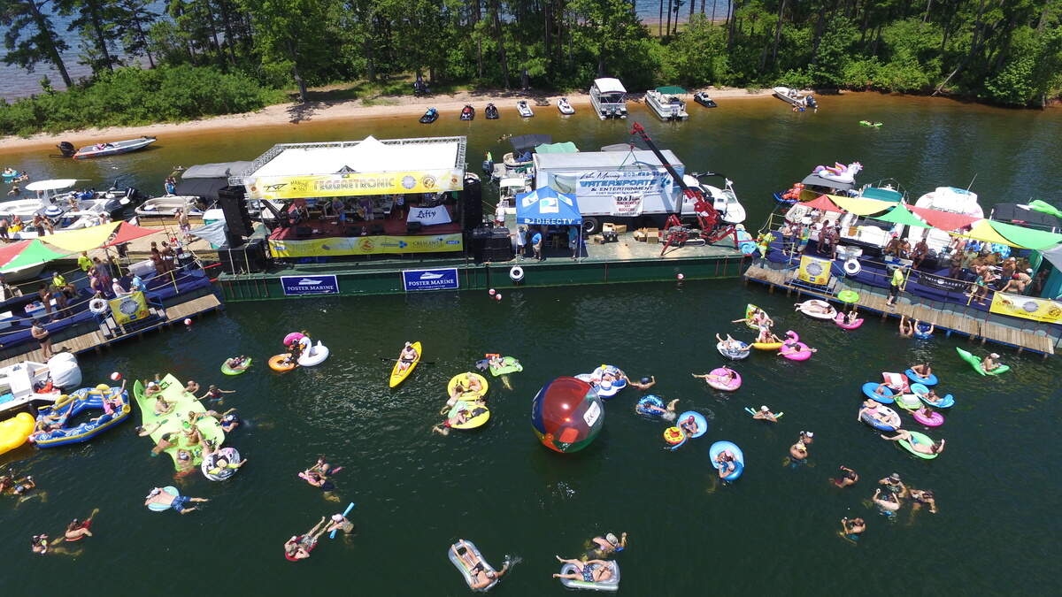 Festivalgoers listen from boats and floats as a band performs at a previous Reggaetronic Music Festival on Lake Murray.