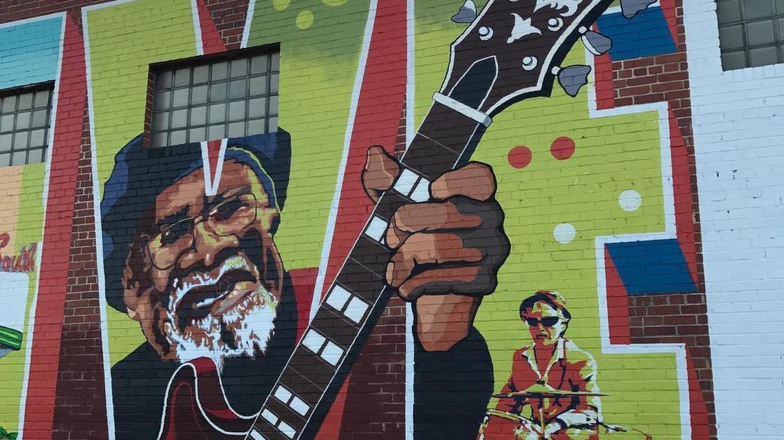 Jazz artist Drink Small is featured prominently on a mural in Five Points