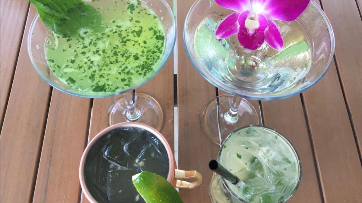 Basil Thai restaurant’s specialty cocktails include, clockwise from top left, the basil lime martini, the sake peach blossom, the pineapple mojito and the angry mule.