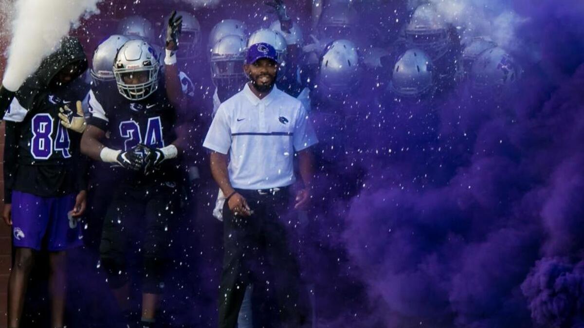 Ridge View head coach Perry Parks leads his team onto the field at District Two Stadium in Blythewood.