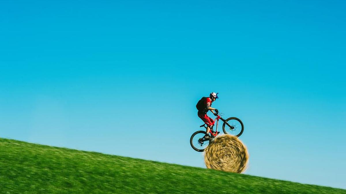“Danny MacAskill’s Wee Day Out:” Danny MacAskill rolls downhill on a hay bale.