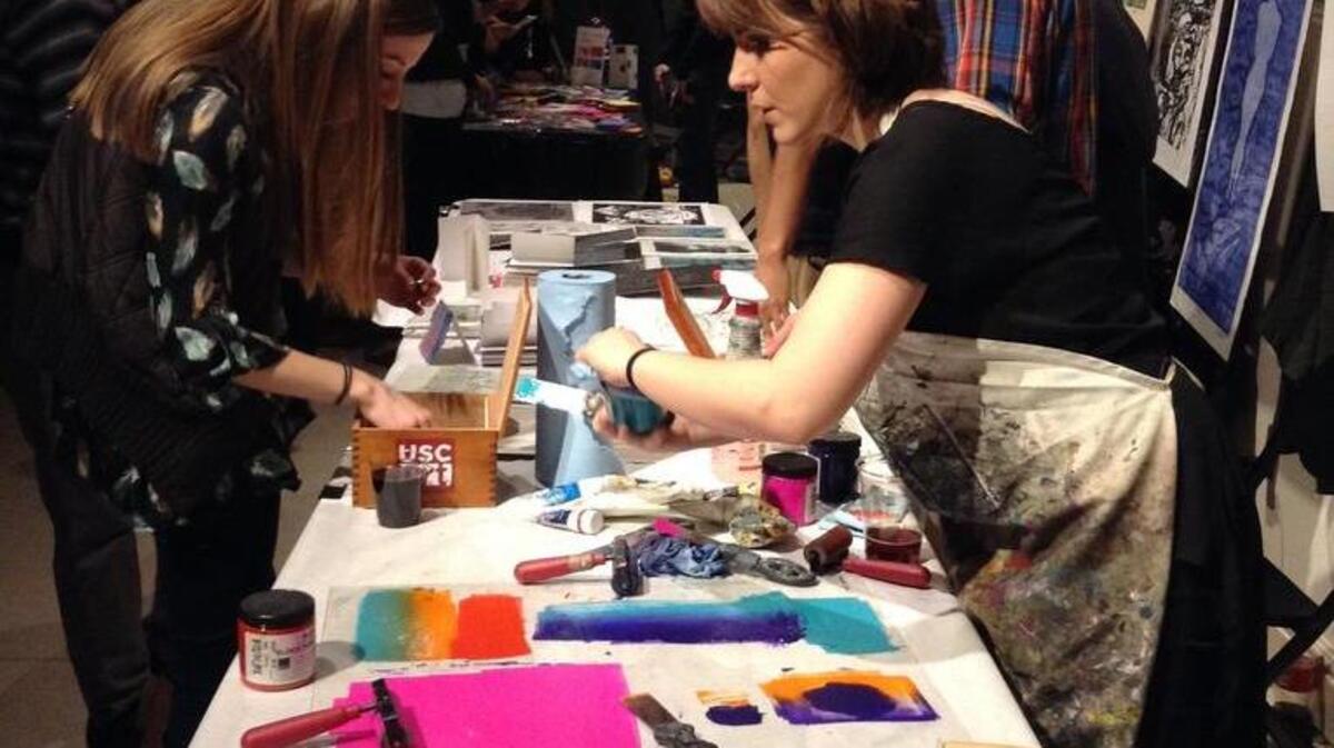 Patrons make crafts at a previous Arts & Draughts event.