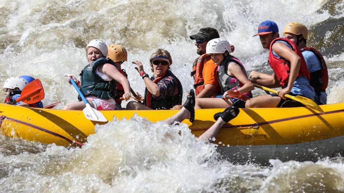 Kayakers and whitewater rafters make their way down the Saluda River on Saturday, May 19, 2015 during a fundraising trip for Canoeing for Kids.