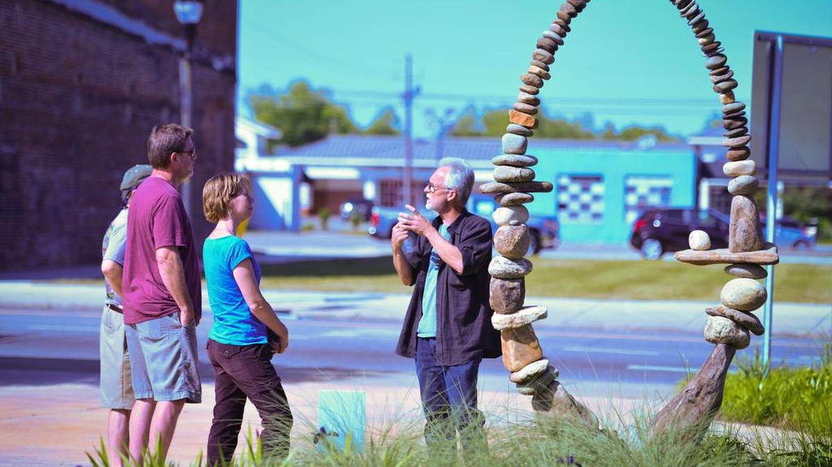 Art lovers admire a rock sculpture at ArtFields 2015.